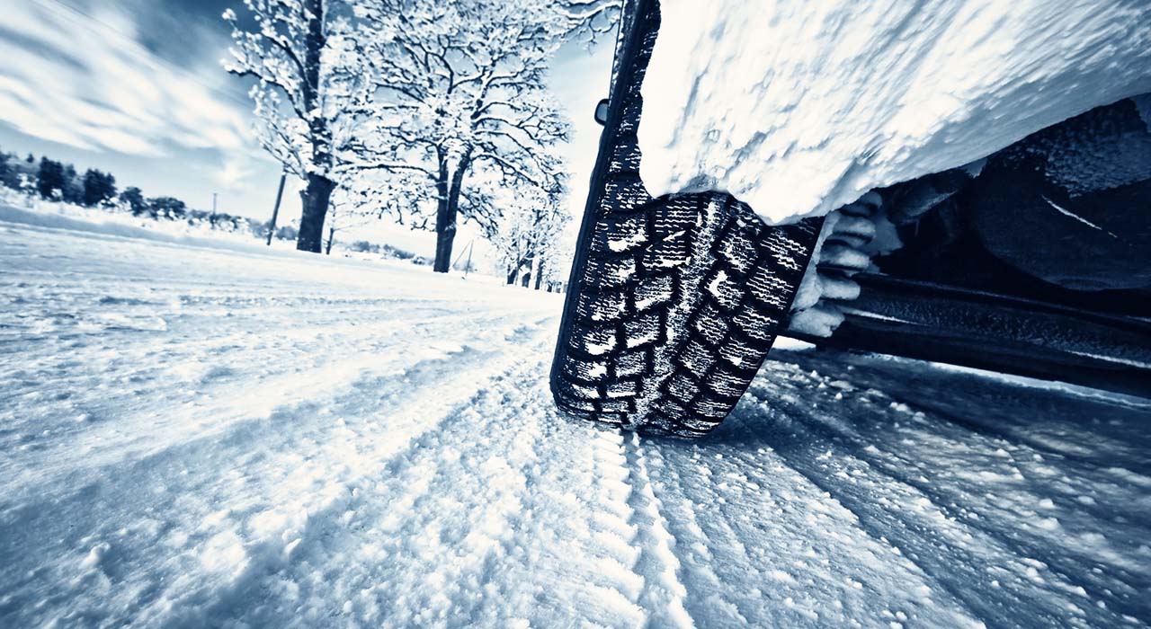 Car tires on winter road
